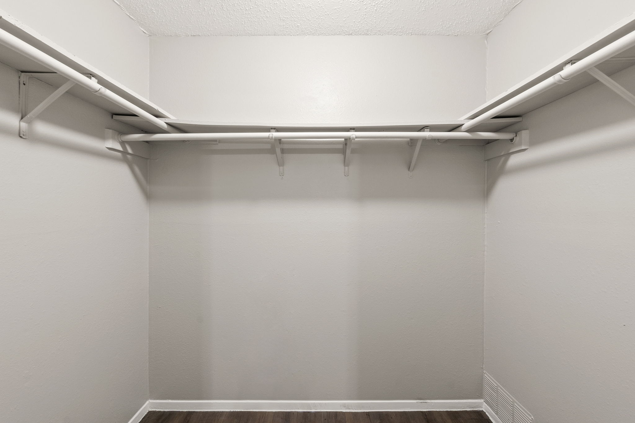 2001 South Interstate 35 Frontage Road, Unit 229 Austin, TX 78741 - Photo 17 of 24 Walk in closet featuring dark wood-type flooring