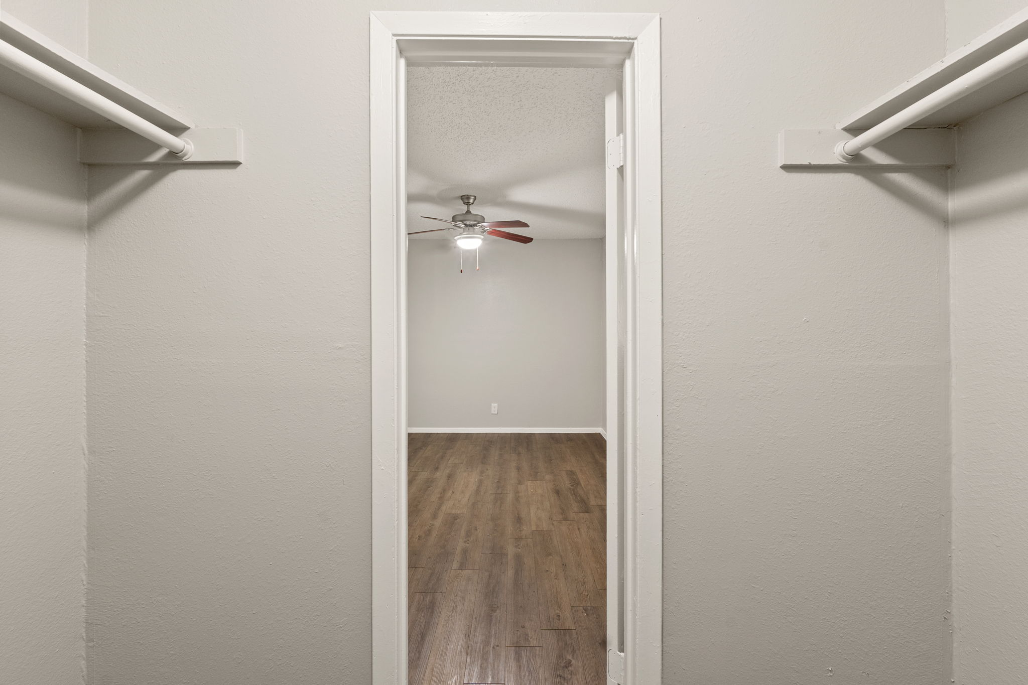 2001 South Interstate 35 Frontage Road, Unit 229 Austin, TX 78741 - Photo 18 of 24 Spacious closet with wood finished floors and ceiling fan