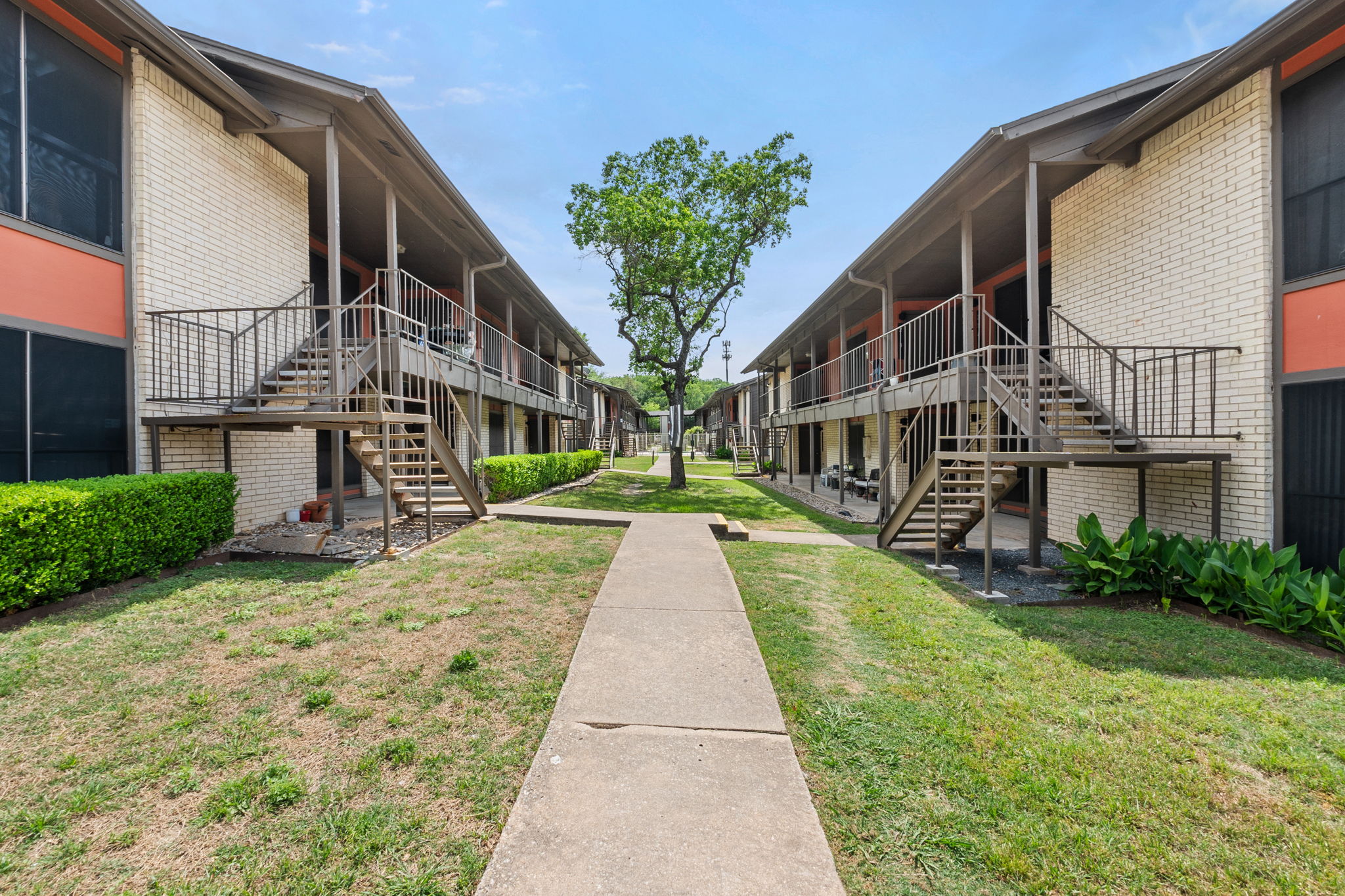 2001 South Interstate 35 Frontage Road, Unit 229 Austin, TX 78741 - Photo 23 of 24 View of home's community featuring stairway and a yard