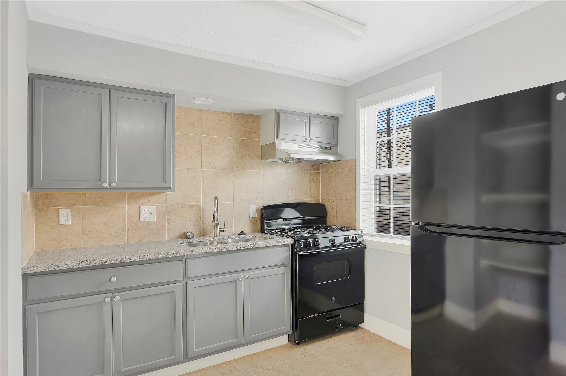 2311 North Louis Street Victoria, TX 77901 - Photo 10 of 18 a kitchen with a refrigerator stove and sink