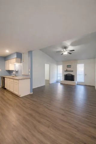 a view of kitchen and livingroom with fireplace