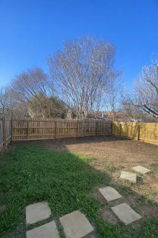a view of backyard with trees