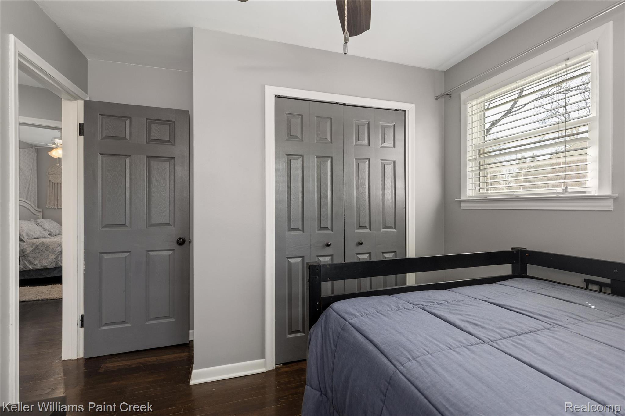 310 Elmhill Road Rochester, MI 48306 - Photo 17 of 37 Bedroom featuring dark wood finished floors, a closet, and a ceiling fan
