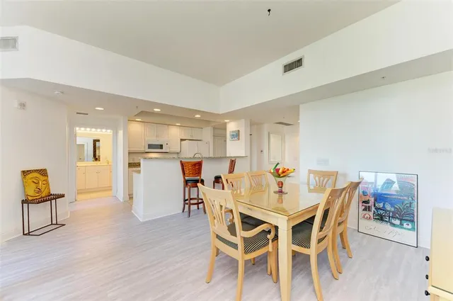 a view of a dining room with furniture and a large window