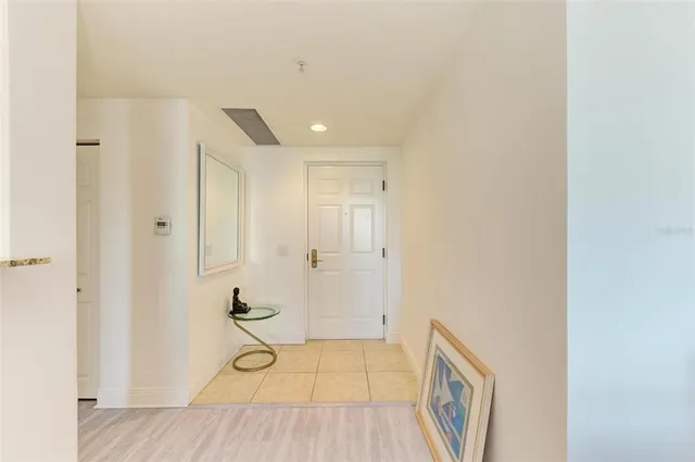 a bedroom with furniture and flat screen tv