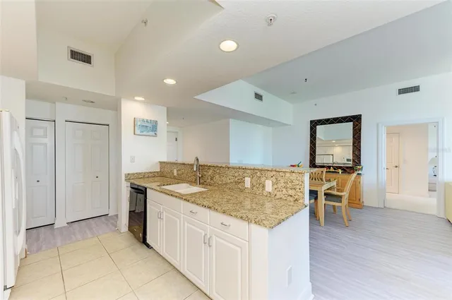 a bedroom with a bed and a lamp