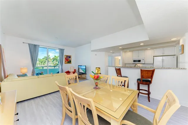a dinning table and chairs in a room