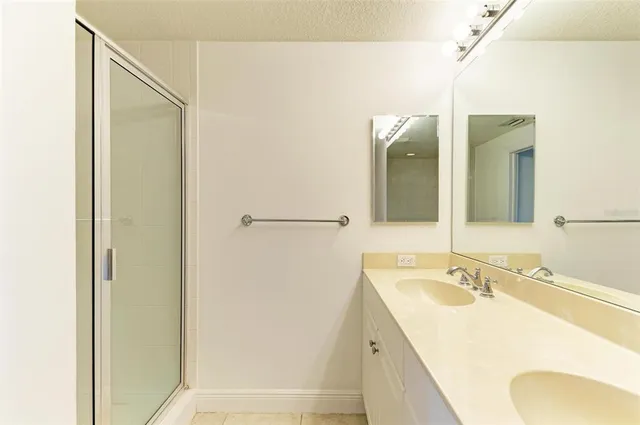 a kitchen with a table chairs sink and cabinets