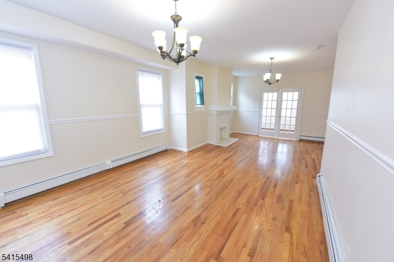 117 Scheerer Avenue Newark, NJ 07112 - Photo 18 of 19 a view of livingroom with kitchen and hardwood