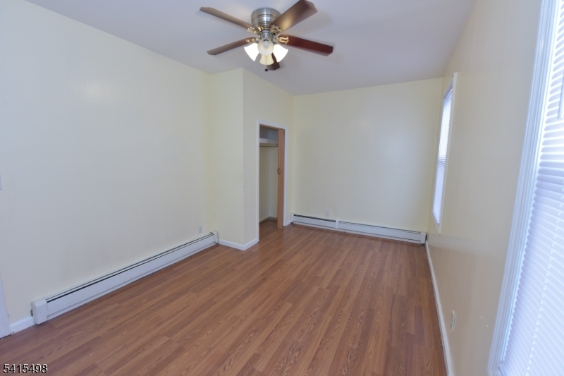 117 Scheerer Avenue Newark, NJ 07112 - Photo 7 of 19 a view of empty room with wooden floor