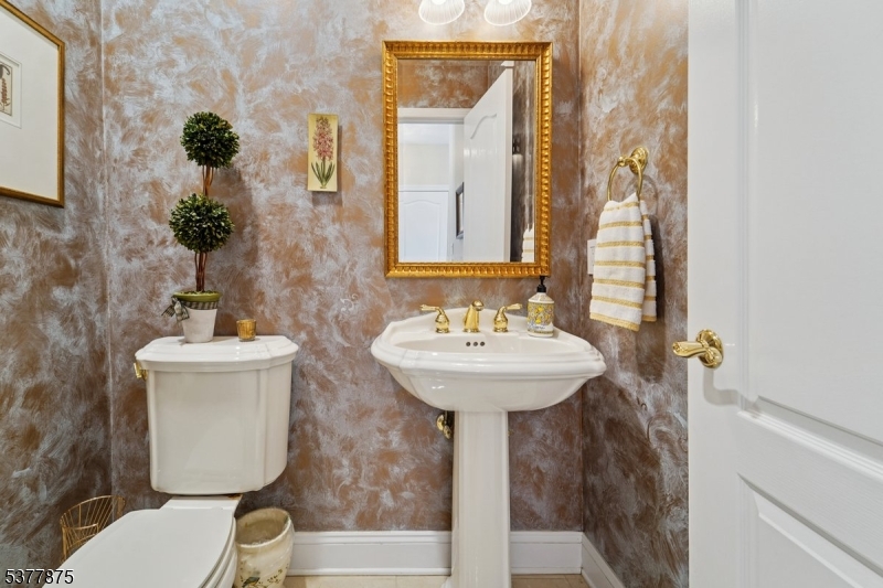 14 Broadway Road Warren, NJ 07059 - Photo 19 of 45 a bathroom with a toilet sink and mirror