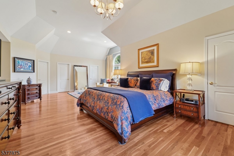 14 Broadway Road Warren, NJ 07059 - Photo 23 of 45 a spacious bedroom with a bed and wooden floor