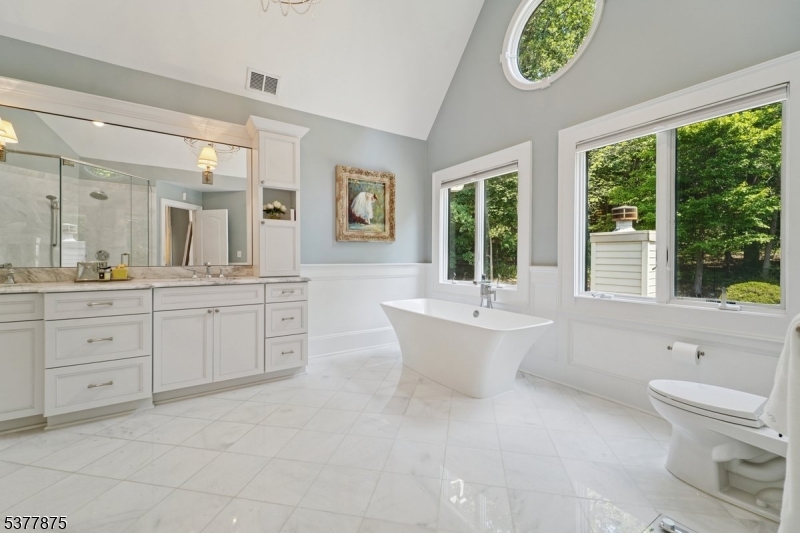 14 Broadway Road Warren, NJ 07059 - Photo 24 of 45 a bathroom with a double vanity sink a toilet and a bathtub