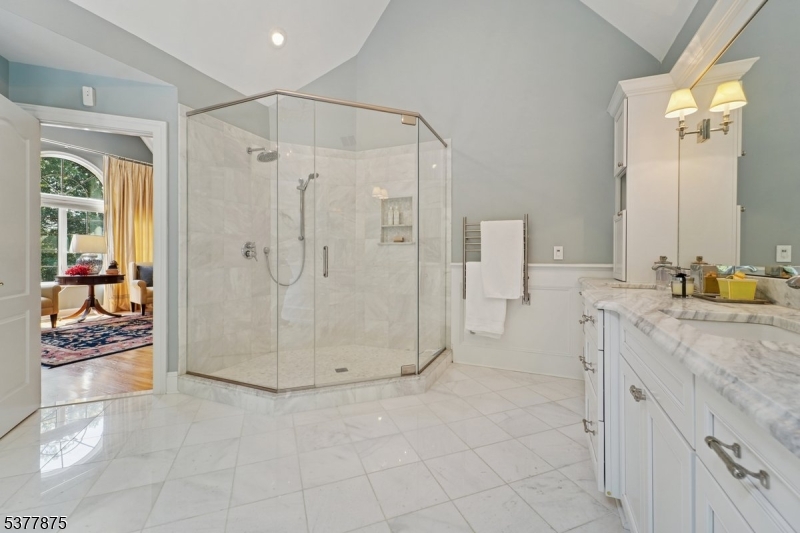 14 Broadway Road Warren, NJ 07059 - Photo 25 of 45 a bathroom with a granite countertop shower a sink and a mirror