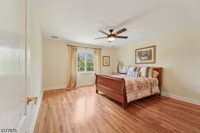 14 Broadway Road Warren, NJ 07059 - Photo 27 of 45 a living room with furniture and a wooden floor