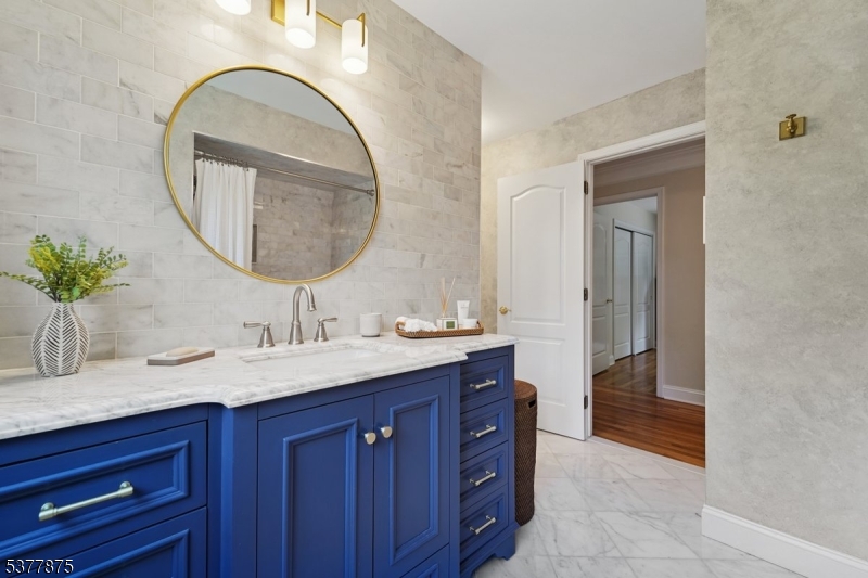14 Broadway Road Warren, NJ 07059 - Photo 29 of 45 a bathroom with a sink and a mirror