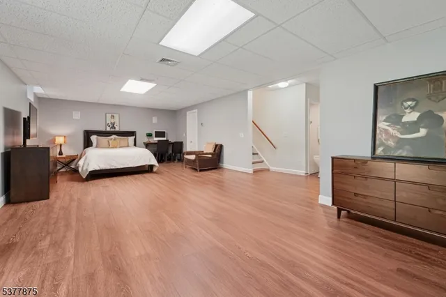 a room with furniture and wooden floor