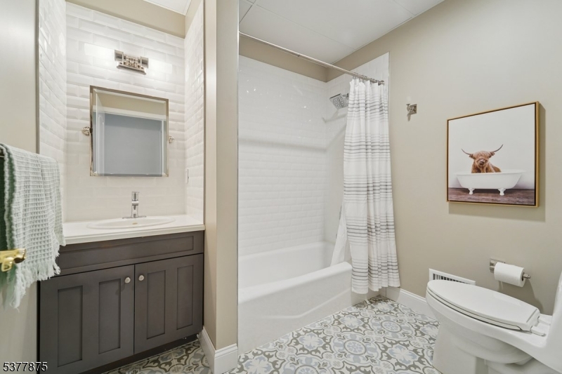 14 Broadway Road Warren, NJ 07059 - Photo 35 of 45 a bathroom with a sink a toilet and shower
