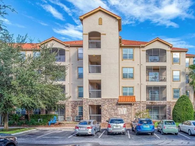 a view of a car parked in front of a building