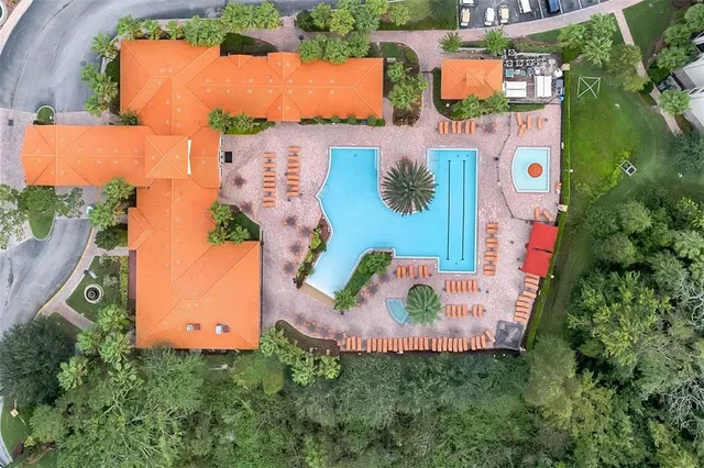 an aerial view of residential house with outdoor space and parking