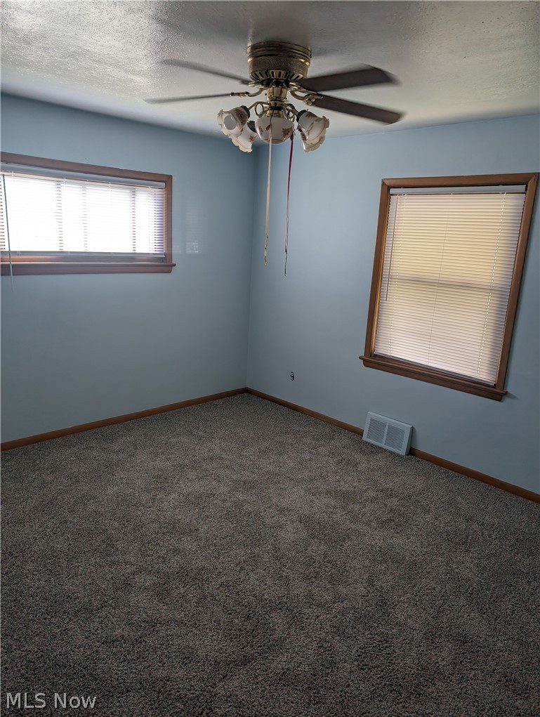 30213 Barjode Road Willowick, OH 44095 - Photo 15 of 20 Carpeted empty room with ceiling fan and a textured ceiling