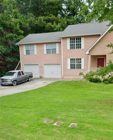 a house view with a garden space