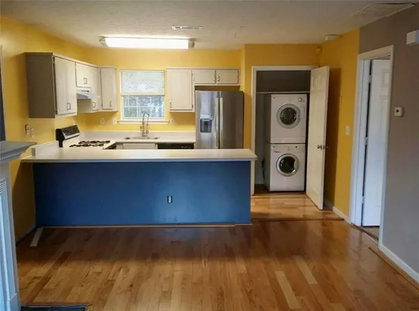 a bathroom with a sink a toilet and a bathtub