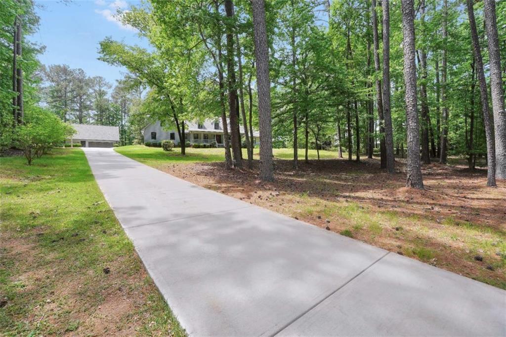 314 Winding Stream Trail Southwest Conyers, GA 30094 - Photo 53 of 59 a view of a yard with swimming pool
