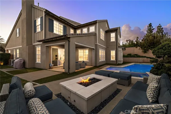 a view of a patio with swimming pool table and chairs