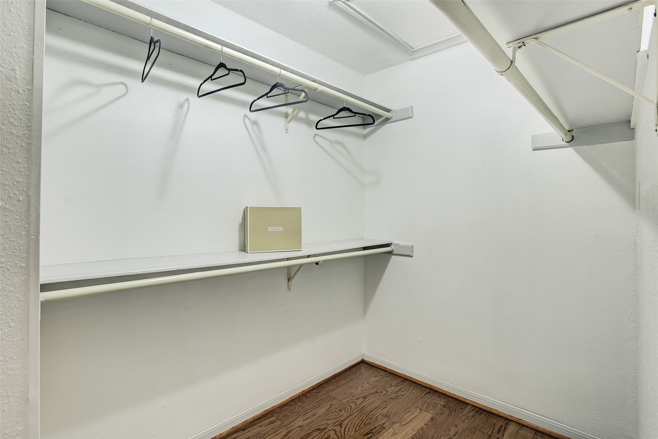 5220 Weslayan Street, Unit 310 Houston, TX 77005 - Photo 11 of 18 a view of a room with racks on the wall