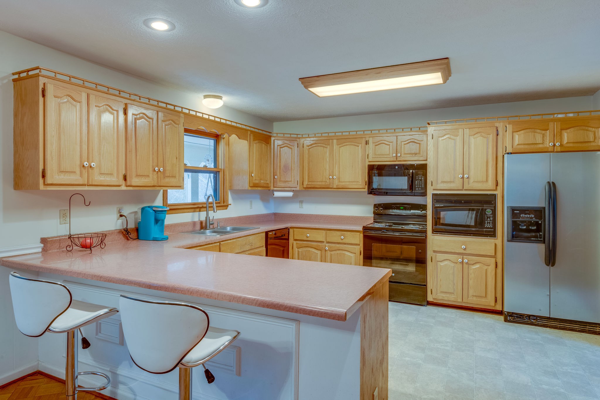 3851 Martins Chapel Road Springfield, TN 37172 - Photo 14 of 37 a kitchen with stainless steel appliances granite countertop a sink a stove a refrigerator cabinets and dining table