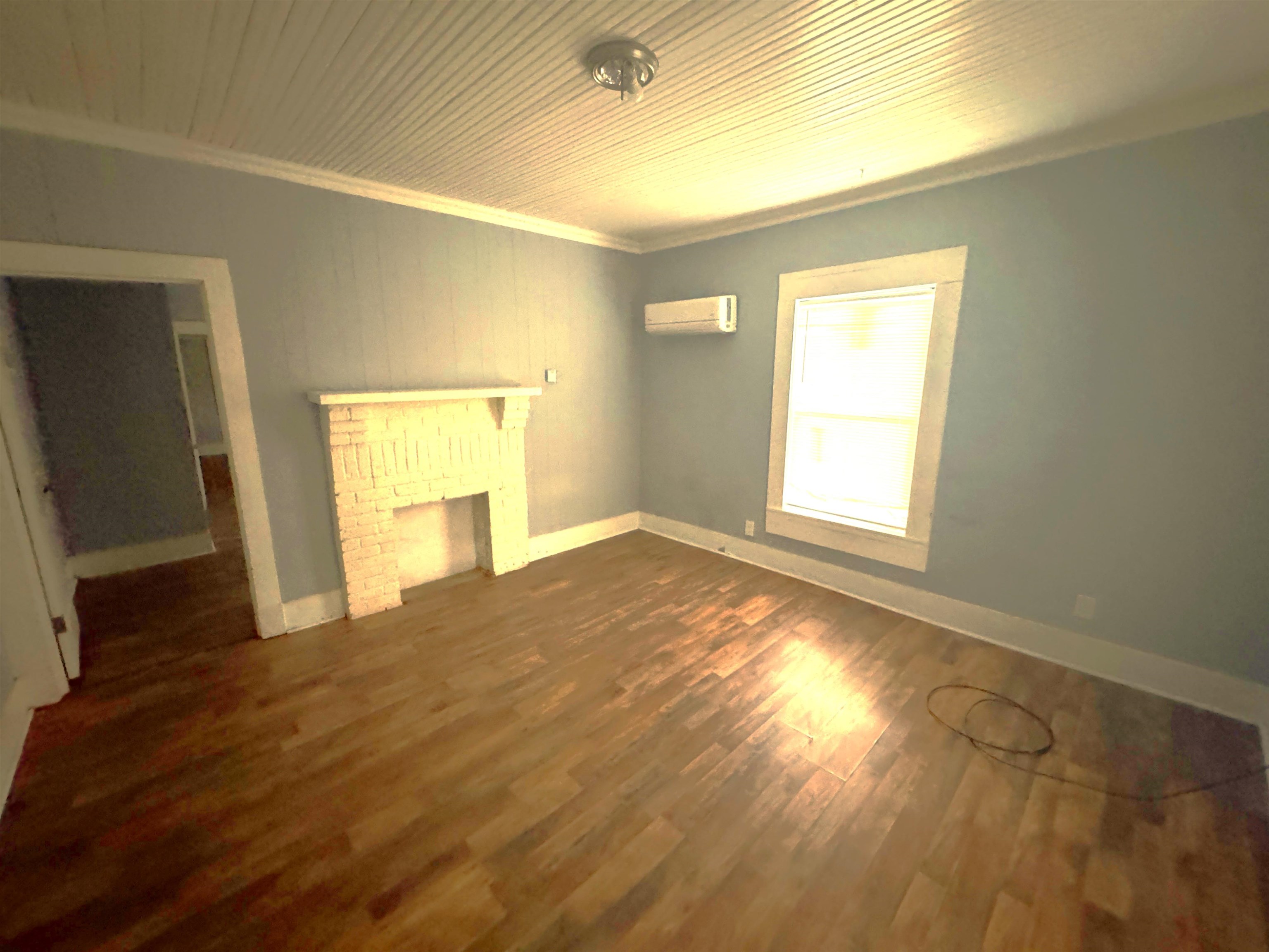 767 Semmes Street Memphis, TN 38111 - Photo 14 of 23 a view of empty room with wooden floor and fan