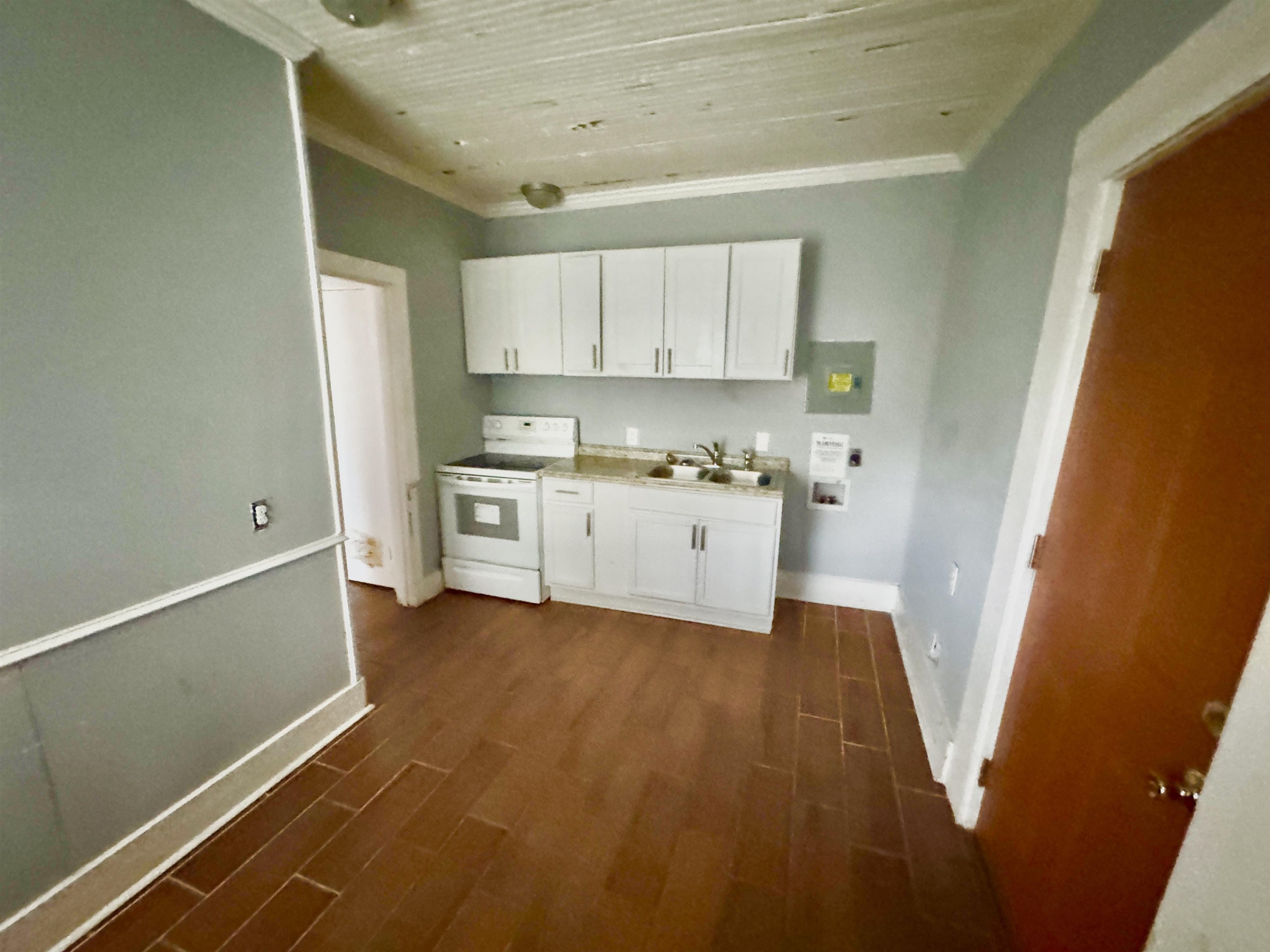 767 Semmes Street Memphis, TN 38111 - Photo 19 of 23 a kitchen with a sink a refrigerator and window