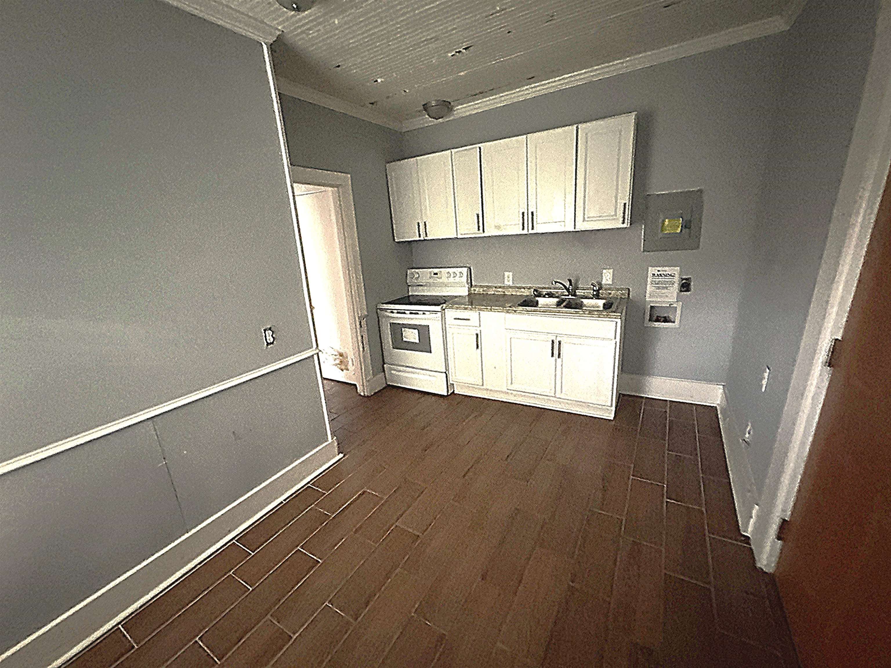 767 Semmes Street Memphis, TN 38111 - Photo 20 of 23 a kitchen with a hard wood floor and a window