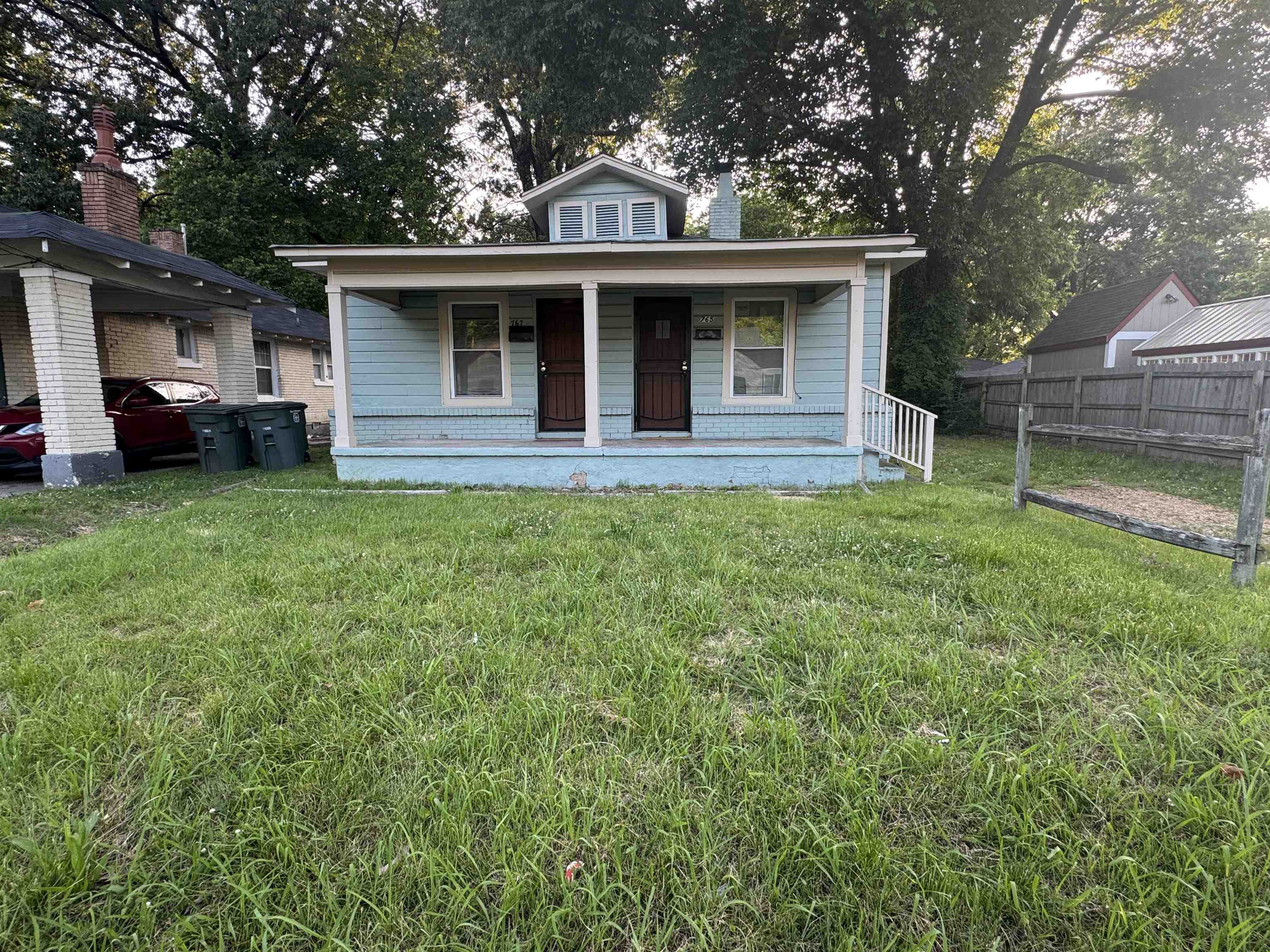 767 Semmes Street Memphis, TN 38111 - Photo 2 of 23 a front view of a house with a garden