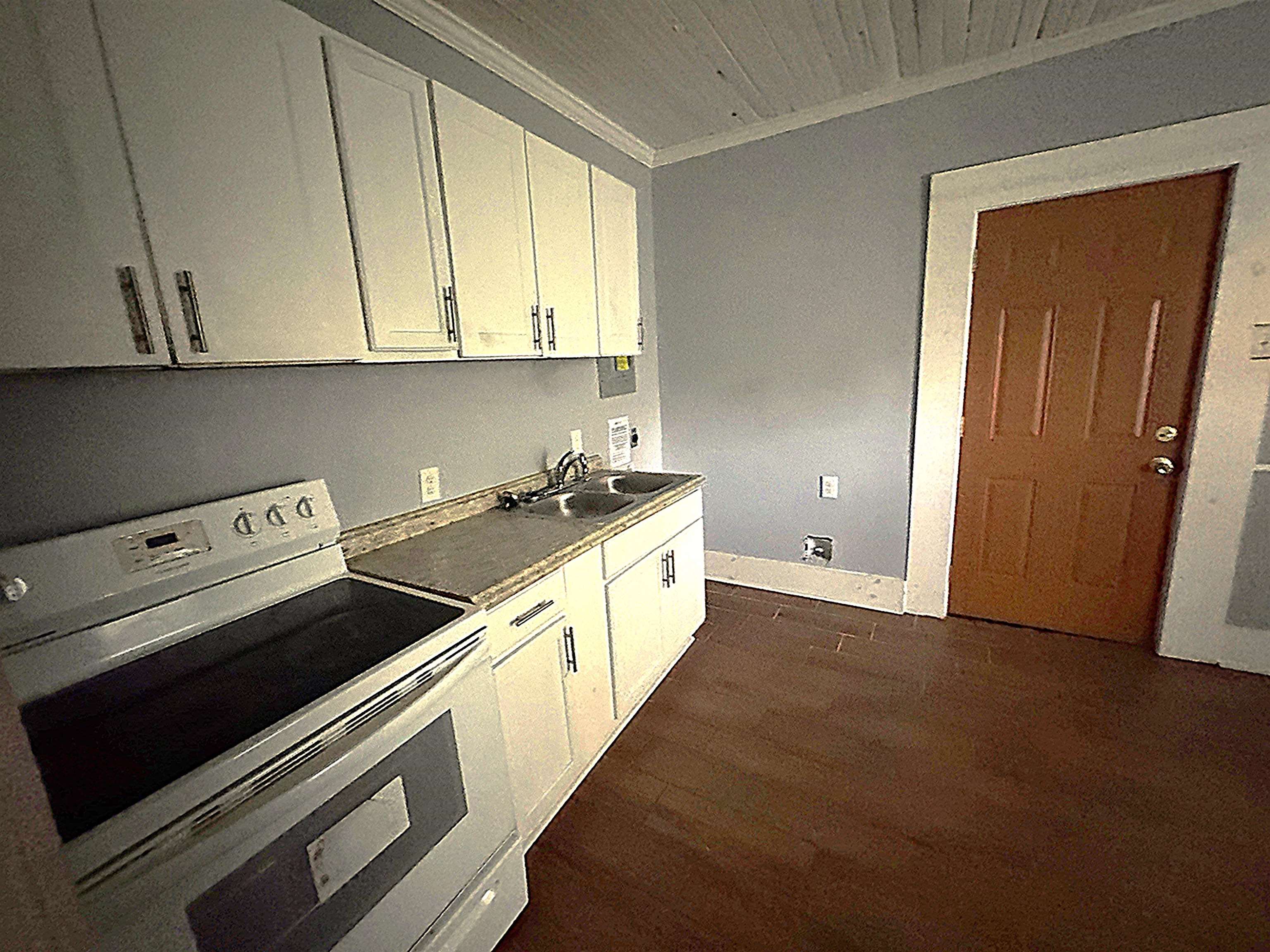 767 Semmes Street Memphis, TN 38111 - Photo 21 of 23 a kitchen with a stove and white cabinets