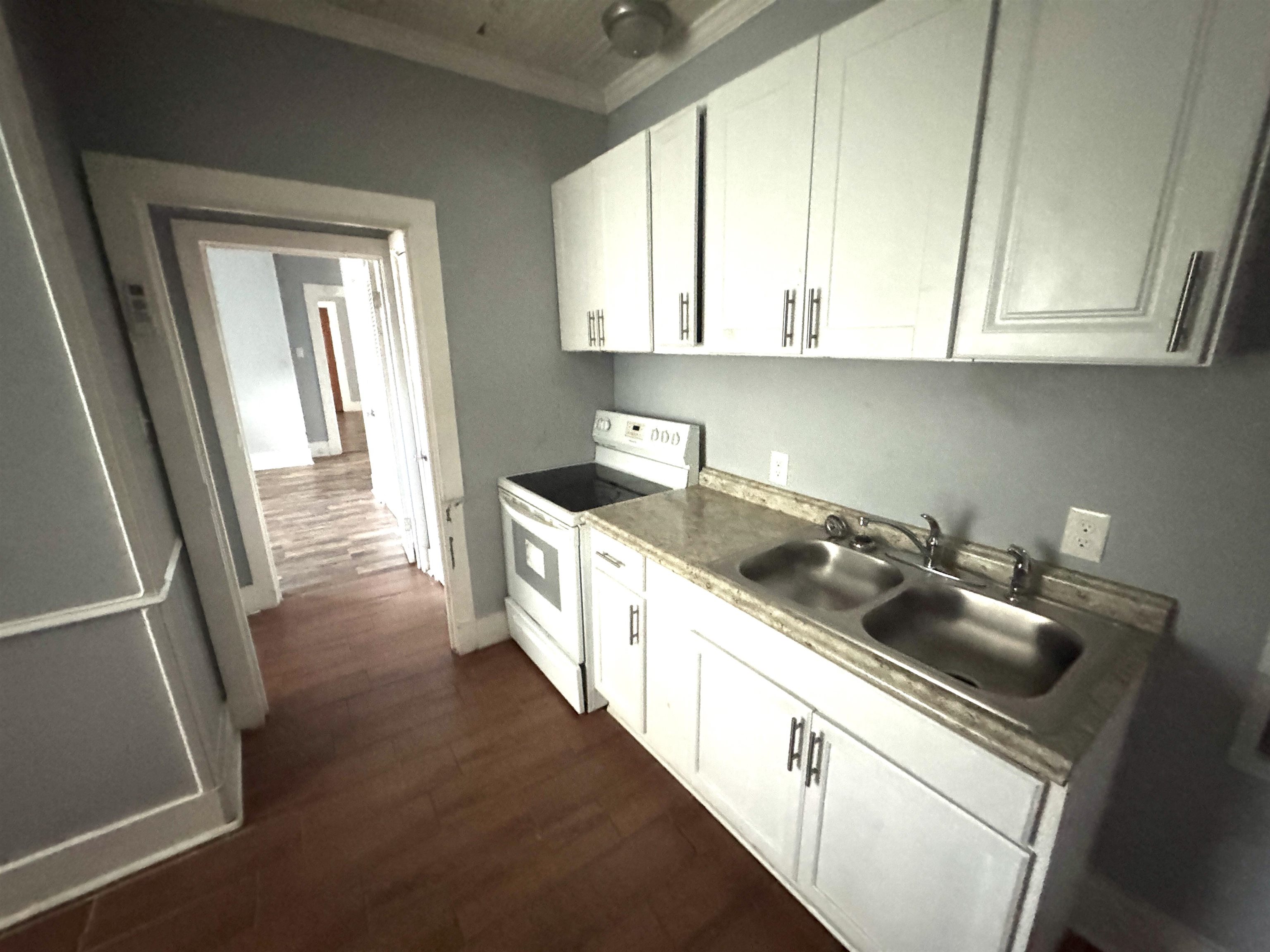 767 Semmes Street Memphis, TN 38111 - Photo 23 of 23 a kitchen with stainless steel appliances granite countertop a sink a stove and cabinets
