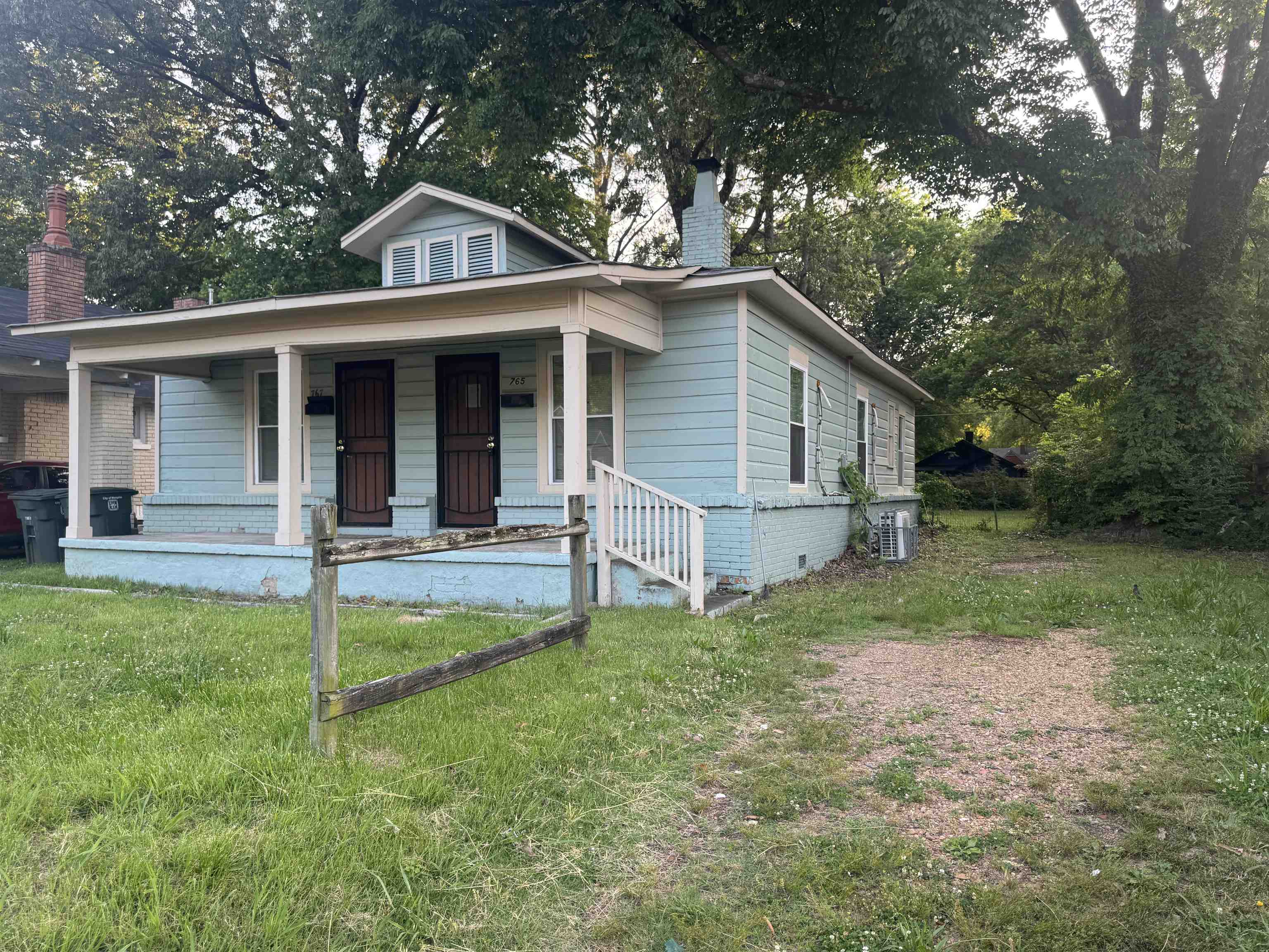 767 Semmes Street Memphis, TN 38111 - Photo 4 of 23 a front view of a house with a yard