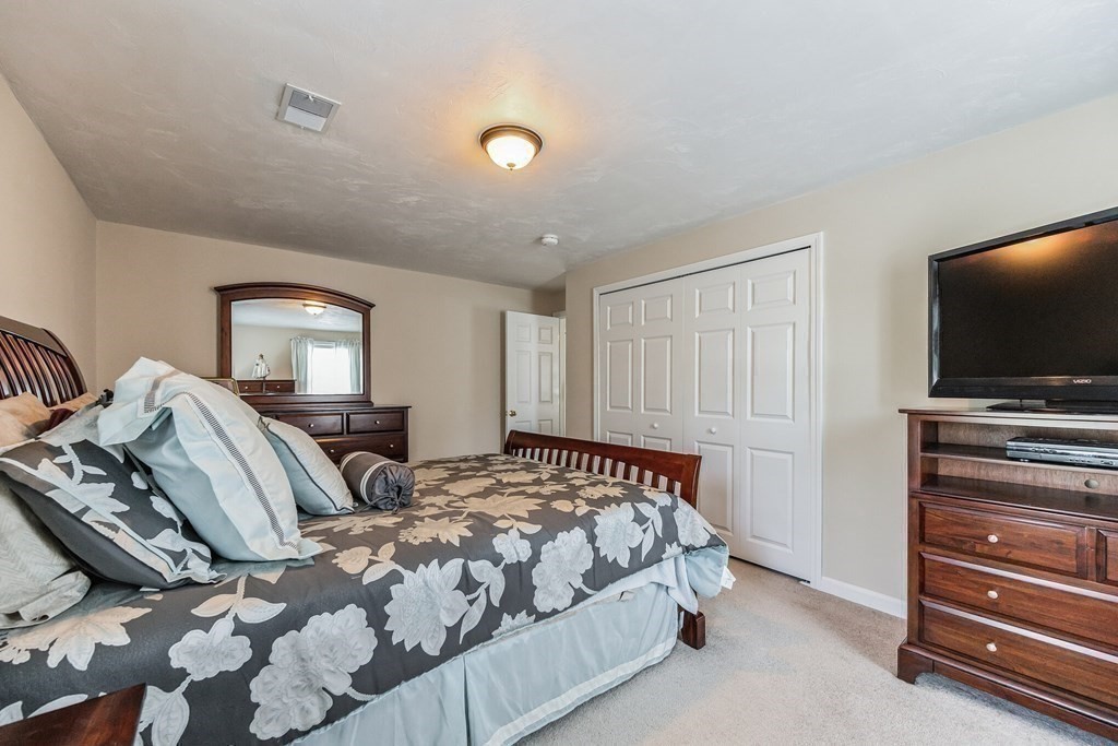 27 Honeysuckle Road Worcester, MA 01607 - Photo 18 of 30 a bedroom with two beds and a flat screen tv