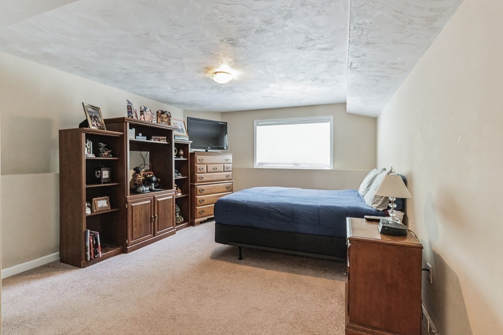 27 Honeysuckle Road Worcester, MA 01607 - Photo 20 of 30 a bedroom with a bed and closet