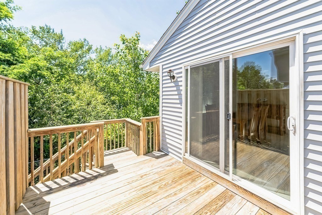 27 Honeysuckle Road Worcester, MA 01607 - Photo 22 of 30 a view of balcony with wooden floor and fence