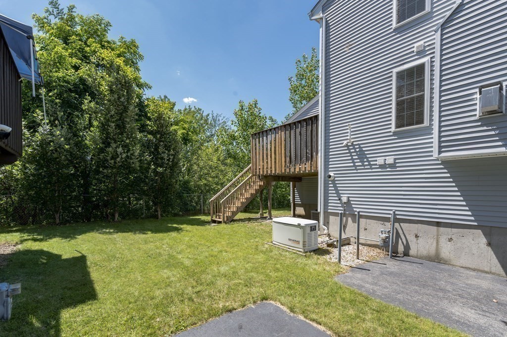 27 Honeysuckle Road Worcester, MA 01607 - Photo 24 of 30 a view of a house with backyard and a tree