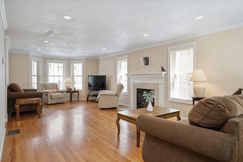 27 Honeysuckle Road Worcester, MA 01607 - Photo 3 of 30 a living room with furniture fireplace and a window