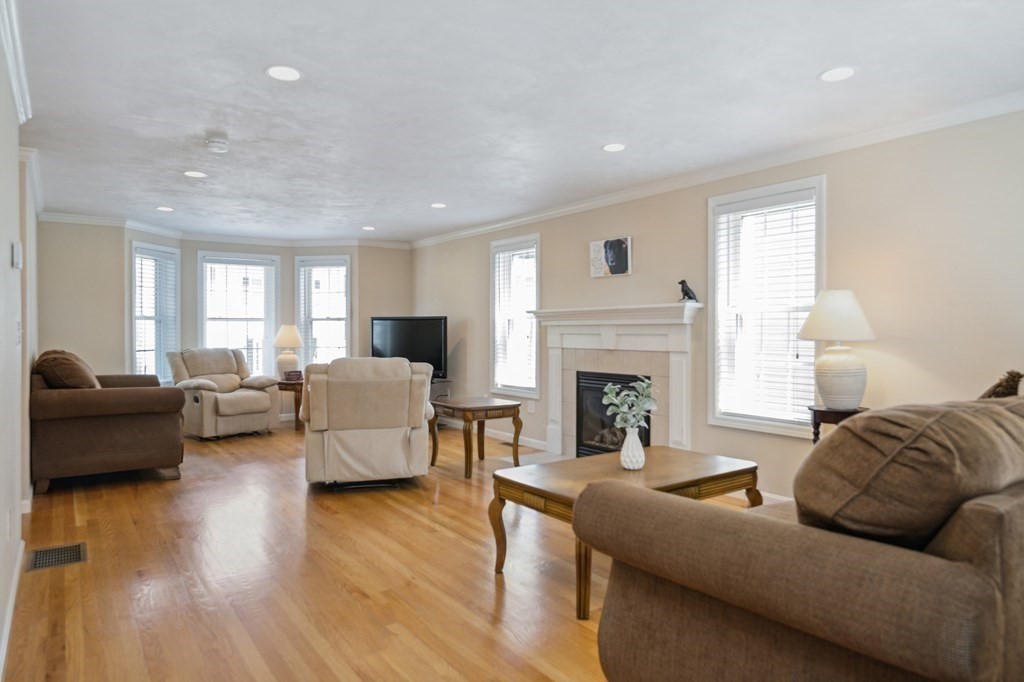 27 Honeysuckle Road Worcester, MA 01607 - Photo 4 of 30 a living room with furniture and a fireplace