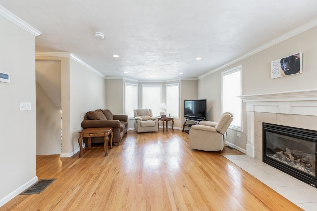 27 Honeysuckle Road Worcester, MA 01607 - Photo 5 of 30 a living room with furniture fireplace and flat screen tv