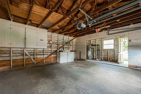 a view of an empty room with wooden walls