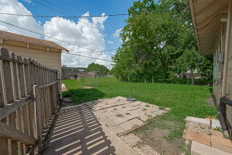 a view of a backyard with sitting area