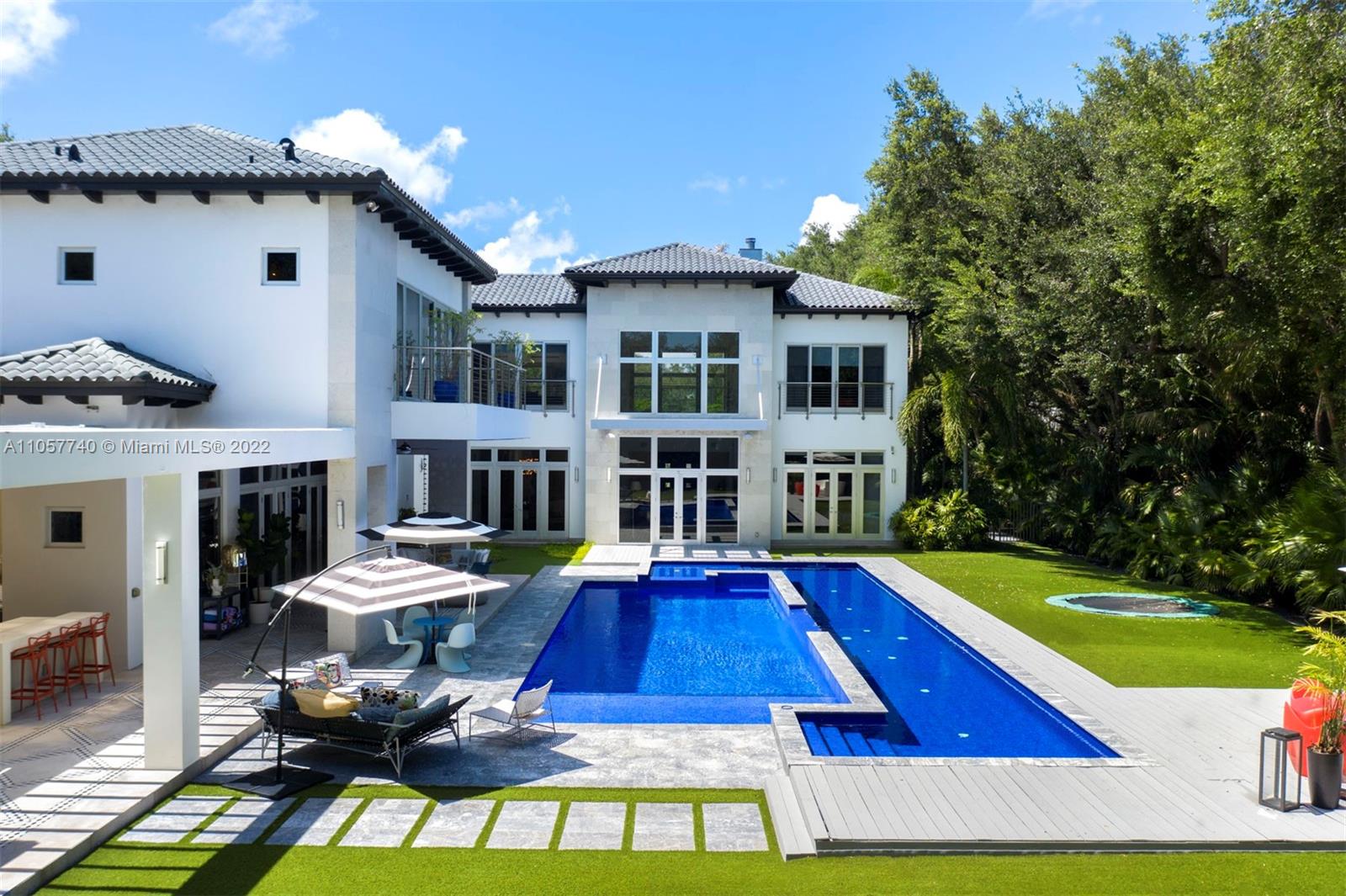 5030 Davis Road Miami, FL 33143 - Photo 14 of 29 a view of a house with pool yard and chairs