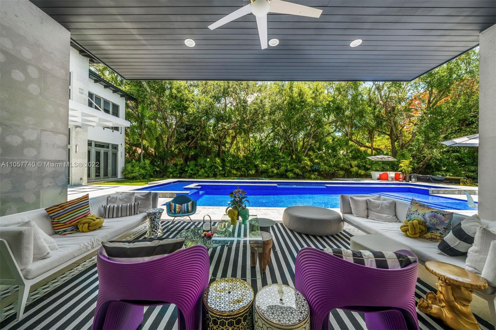 5030 Davis Road Miami, FL 33143 - Photo 16 of 29 a view of a patio with table and chairs potted plants with wooden floor