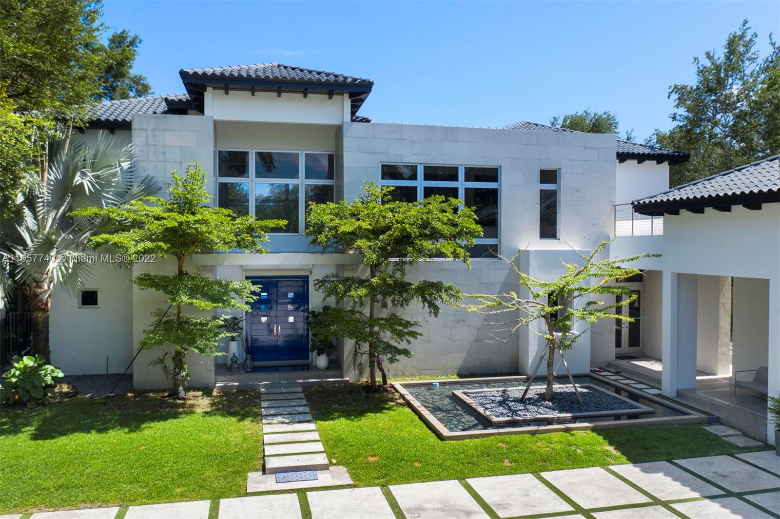 5030 Davis Road Miami, FL 33143 - Photo 2 of 29 a front view of a house with garden